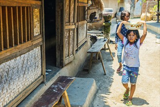 Children on the street in an Indonesian village, village, child, girl, childhood, carefree,