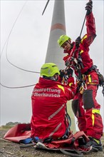 Height rescuers from the Oberhausen professional fire brigade practise abseiling from a wind