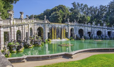 Fountain sculptures at the water basins in the garden of the royal palace Palazzo Reale, Italian