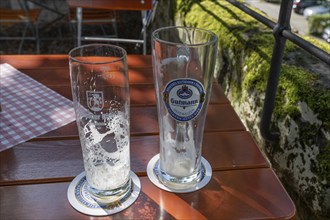 Empty beer glasses on a table in a beer garden, Bavaria, Germany, Europe