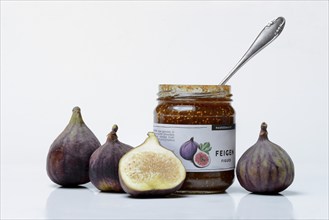 Fig jam in a jar and fresh figs, Ficus carica