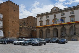 A square with classic cars and historic buildings in the background, town hall, Ayuntamiento,