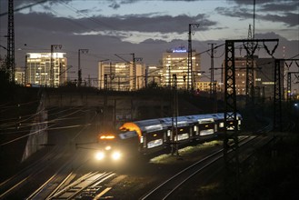 Skyline of Essen city centre, railway facilities in front of the main station, regional train,