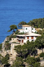 Villas on the cliffs in the north-west of the island, near Alconàsser, Serra de Tramuntana,