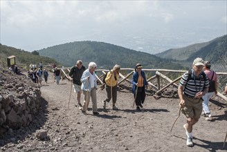 Tourists walking on a path to Vesuvius, near Naples, Parco Nazionale del Vesuvio, Campania, Italy,