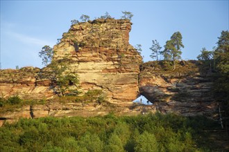 Büttelsfelsen Dahn natural monument in the evening sun. The striking rock massif is a red sandstone