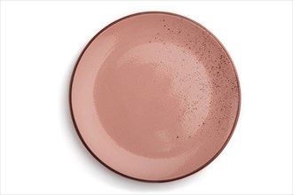 Empty pink dotted ceramic plate isolated on white background. Top view, close up