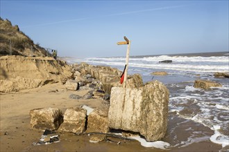 March 20 2018 Hemsby, UK. Coast path sign left abandoned by coastal erosion at Hemsby, Norfolk,