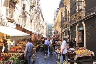 Fruit, vegetables, cheese and meat at the historic market in Catania, Sicily, Italy, Europe