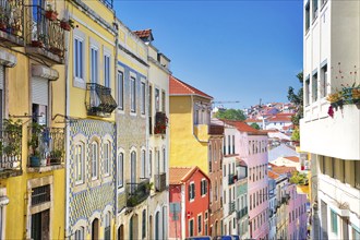 Colorful buildings of Lisbon historic center near landmark Rossio Square