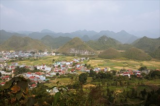 Panorama of Tam Son town and the Twin Mountains or Fairy Breast Mountains, Quan Ba district, seen