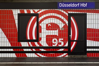 Large logo in club colours of Fortuna Düsseldorf on a wall with tiles, Düsseldorf Central Station,