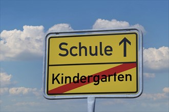 Town exit sign with the lettering Kindergarten / School