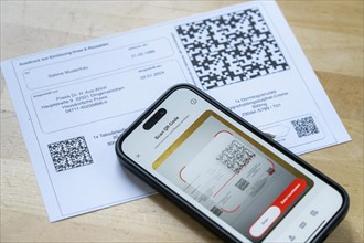 Symbolic image of an e-prescription, prescription issued by a doctor, with QR code, is scanned