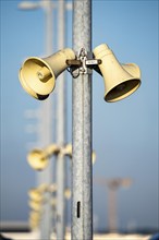 Loudspeakers, on masts, on the car park deck, for announcements, emergency messages, funnel