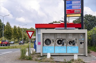 Self-service washing machines, for laundry, clothing, open 24 hours, around the clock, at a petrol