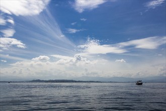 Blue sea and blue sky with clouds