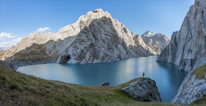 Hiker in front of Kol Suu Mountain Lake, Kol Suu Lake, Sary Beles Mountains, Naryn Province,