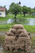 Sandbags, continuous rain, high water, flooding, town, houses, Whitsun floods 2013, climate change,