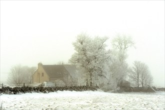 Aubrac plateau. Isolated farm in winter. Lozere department. Occitanie. France