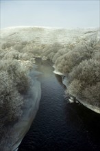 Aubrac plateau. Frozen river Bès. Lozere department. Occitanie. France