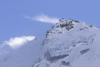 Snow covered mountain top, pinnacle Cima dell'Arolley in winter in the Gran Paradiso Massif of the