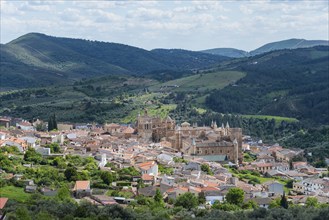 A historic town nestled in a hilly landscape on a clear day with clouds and blue sky, Guadalupe,