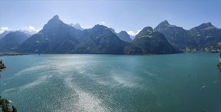 Lake Uri, part of Lake Lucerne near Flüelen, windsurfers in front of the mountains of the Alps.