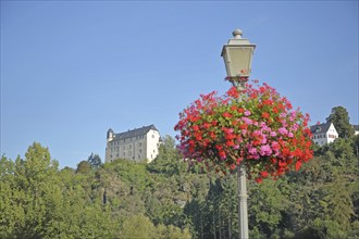 Schadeck Castle built in 1288 and street lamp with floral decoration, flowers, Runkel, Westerwald,