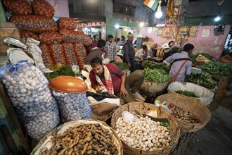 Vendor selling vegetables at a market, ahead of the presentation of the Interim Budget 2024 by