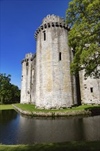 Historic stone ruins and moat of Nunney Castle, Somerset, England, UK