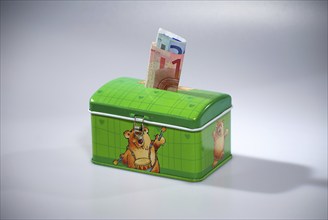 Metal money box with euro banknotes in the slot, Hamburg, Hamburg, Federal Republic of Germany