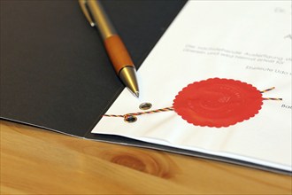 Notarised contract with red official seal