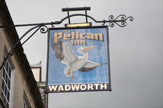 Pub sign for Wadworth beer at the Pelican Inn, Devizes, Wiltshire, England, United Kingdom, Europe