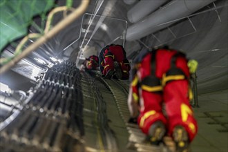 Height rescuers from the Oberhausen professional fire brigade practise abseiling from a wind