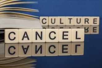 Symbolic image Cancel Culture: Letter cubes show the words Cancel Culture in front of a book