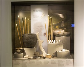 Display of objects found deposited at Neolithic meeting places and monuments in Wiltshire. With