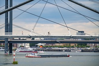 Pedestrian bridge over the Medienhafen, harbour entrance and Rheinkniebrücke, over the Rhine near