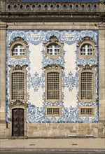 The facade of Igreja do Carmo church, adorned with intricate blue and white tiles, Porto, Portugal,