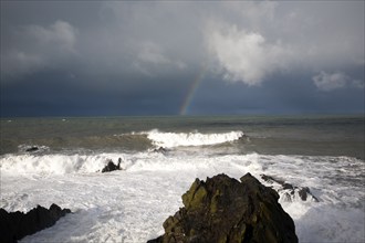 Large Atlantic storm waves crashing onto jagged rocky coast at Hartland Quay, north Devon, England,