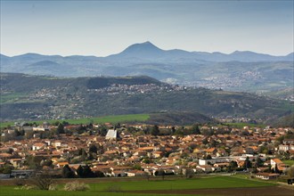 View on Vic le Comte village, Puy de Dome volcano in background, Limagne plain, Puy de Dome