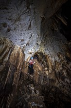 Woman exploring stalactite cave, Terciopelo Cave, Barra Honda National Park, Costa Rica, Central