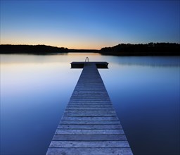 Quiet lake with bathing jetty after sunset, bathing area, Mecklenburg Lake District,