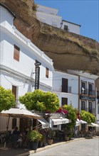 Street in Setenil de las Bodegas with restaurants and shops under rocks, cave dwellings, Setenil de