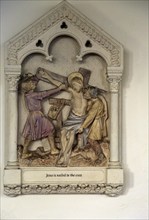 Jesus is nailed to the Cross, stations of the cross, Ufford church, Suffolk, England, UK