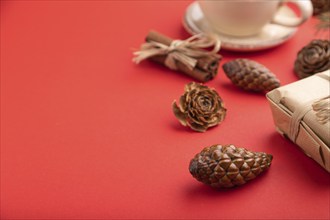 Christmas or New Year composition. Decorations, box, cinnamon, cones, fir and spruce branches, cup