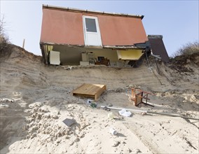 March 2018, Clifftop property collapsing due to coastal erosion after recent storm force winds,