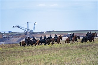 Police deployment, equestrian squadron, at the protest against the demolition of the village of