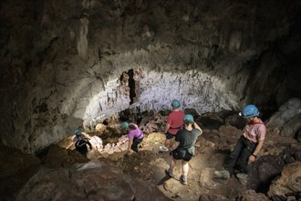 Visitors in a stalactite cave, Terciopelo Cave, Barra Honda National Park, Costa Rica, Central