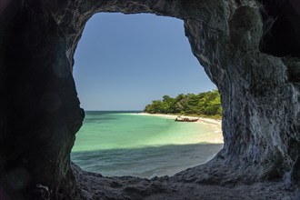 View through the rocks to the beach on Koh Lao Liang Island, Thailand, Asia